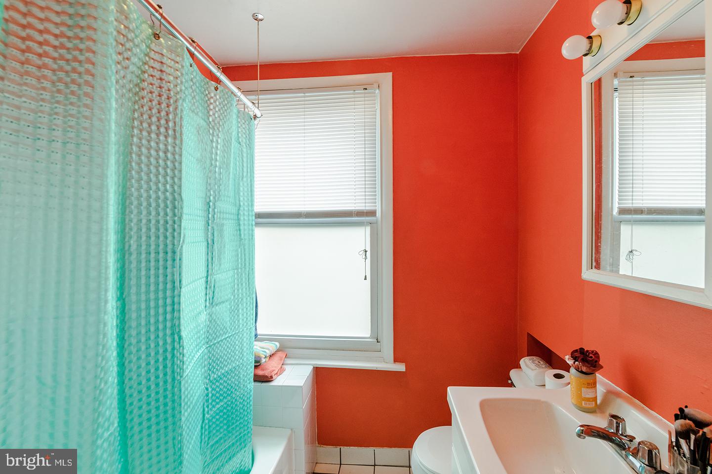 620 South 3rd Street, Unit 2 Philadelphia, PA 19147 - Photo 9 of 10 a bathroom with a sink and a mirror