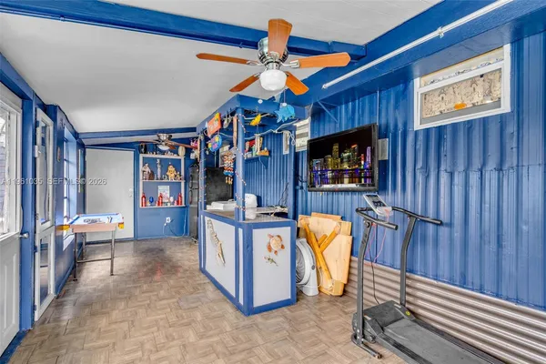 a view of an entryway with wooden walls