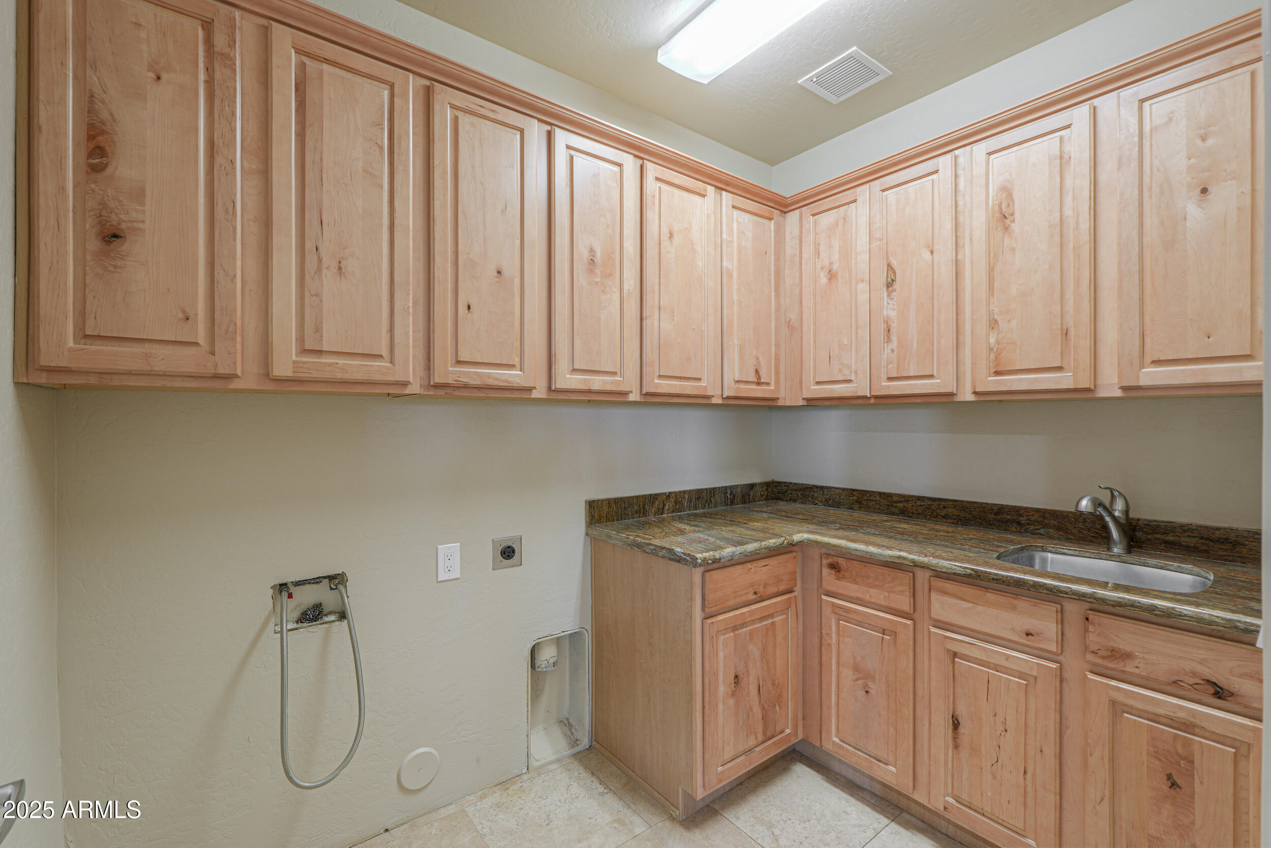 53304 West Barnes Road Maricopa, AZ 85139 - Photo 20 of 75 a kitchen with appliances cabinets and a sink