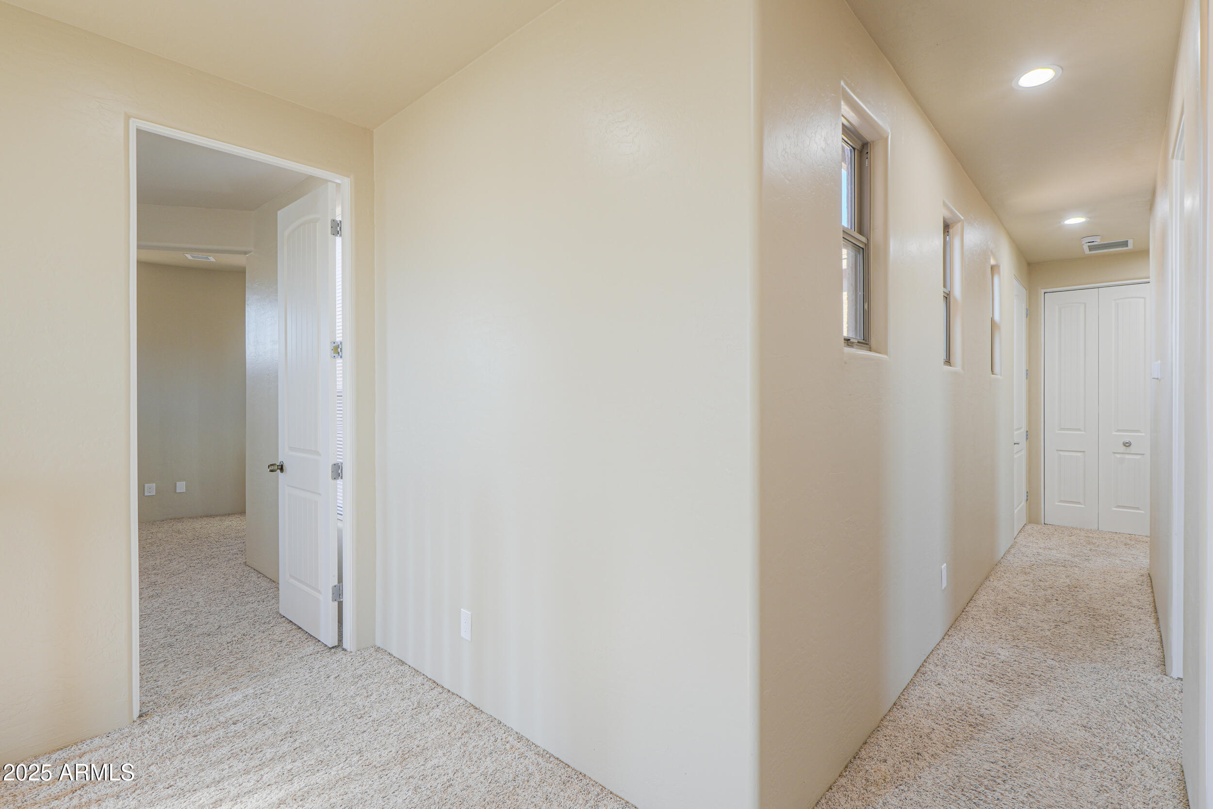 53304 West Barnes Road Maricopa, AZ 85139 - Photo 27 of 75 a view of a hallway with wooden floor