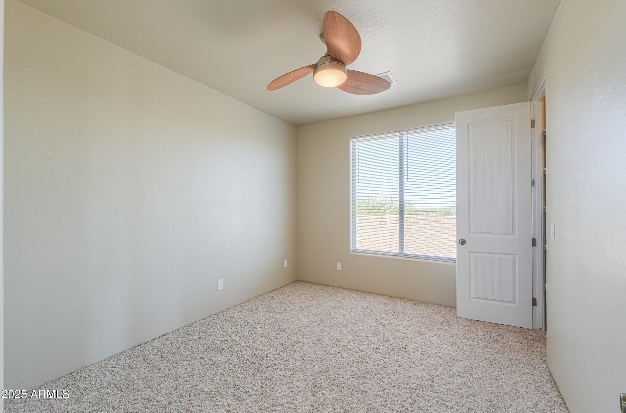 53304 West Barnes Road Maricopa, AZ 85139 - Photo 29 of 75 a view of an empty room with a window