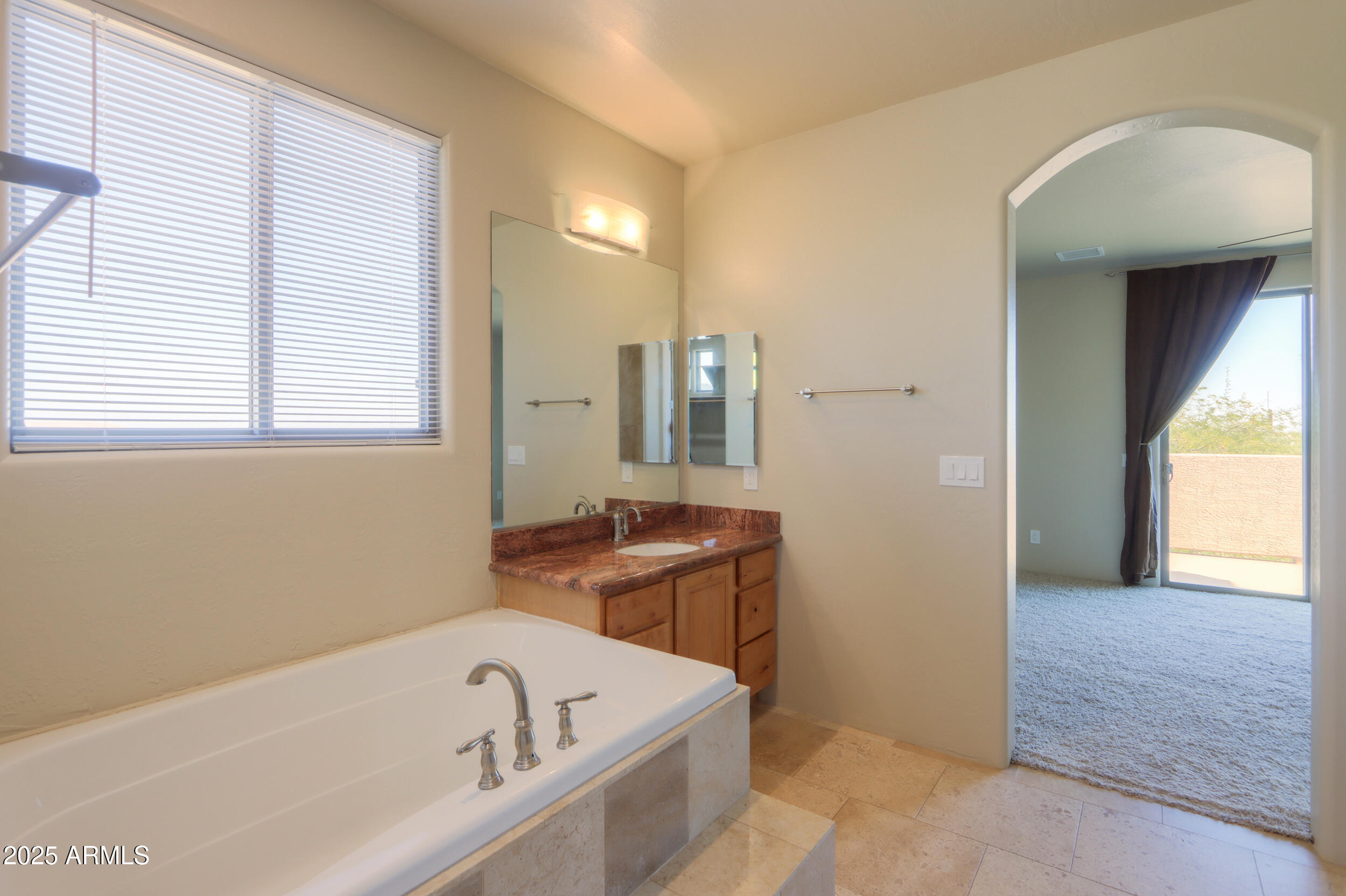 53304 West Barnes Road Maricopa, AZ 85139 - Photo 36 of 75 a bathroom with a bathtub and a sink