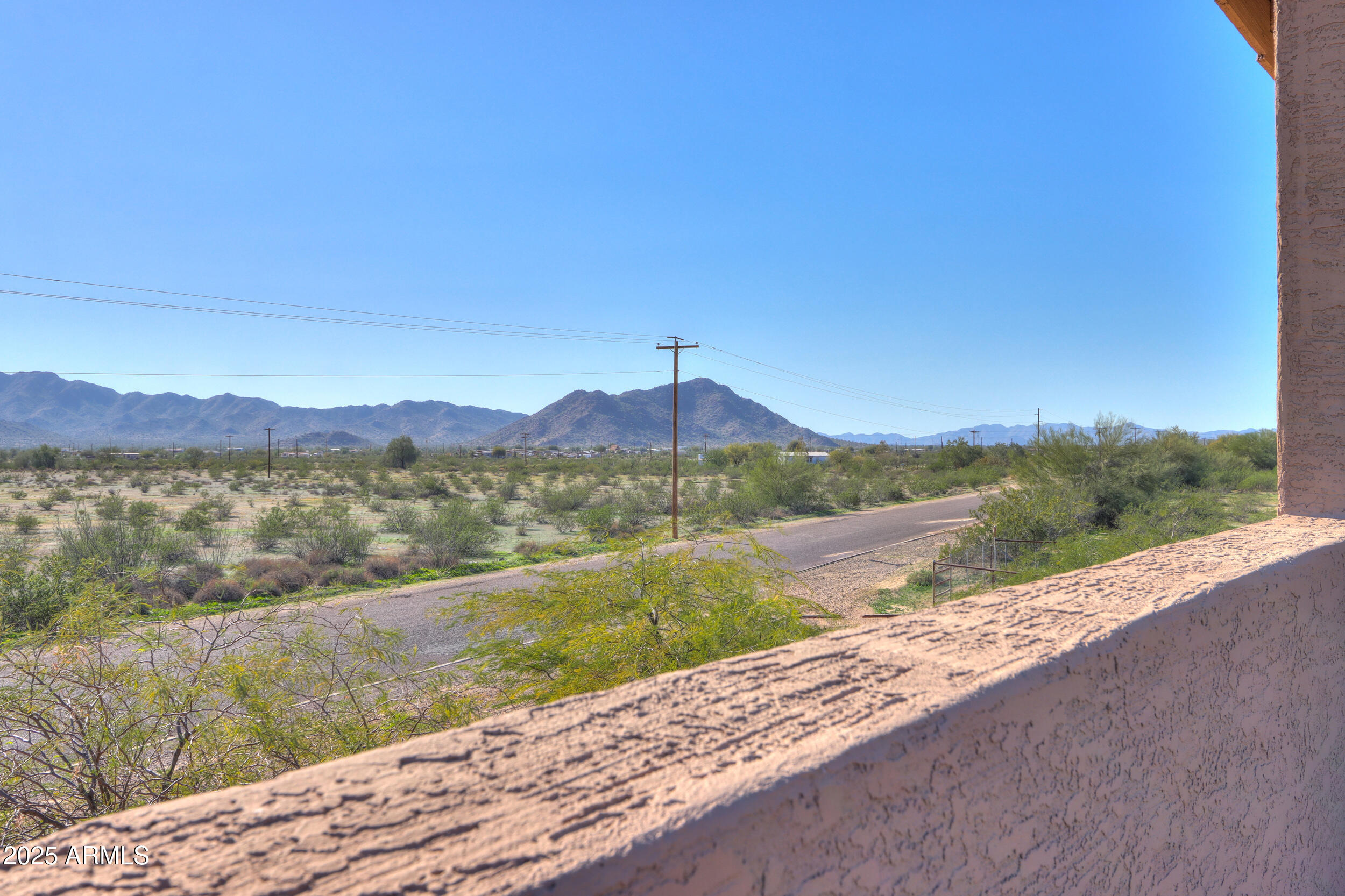 53304 West Barnes Road Maricopa, AZ 85139 - Photo 43 of 75 a view of a lake with a mountain in the background