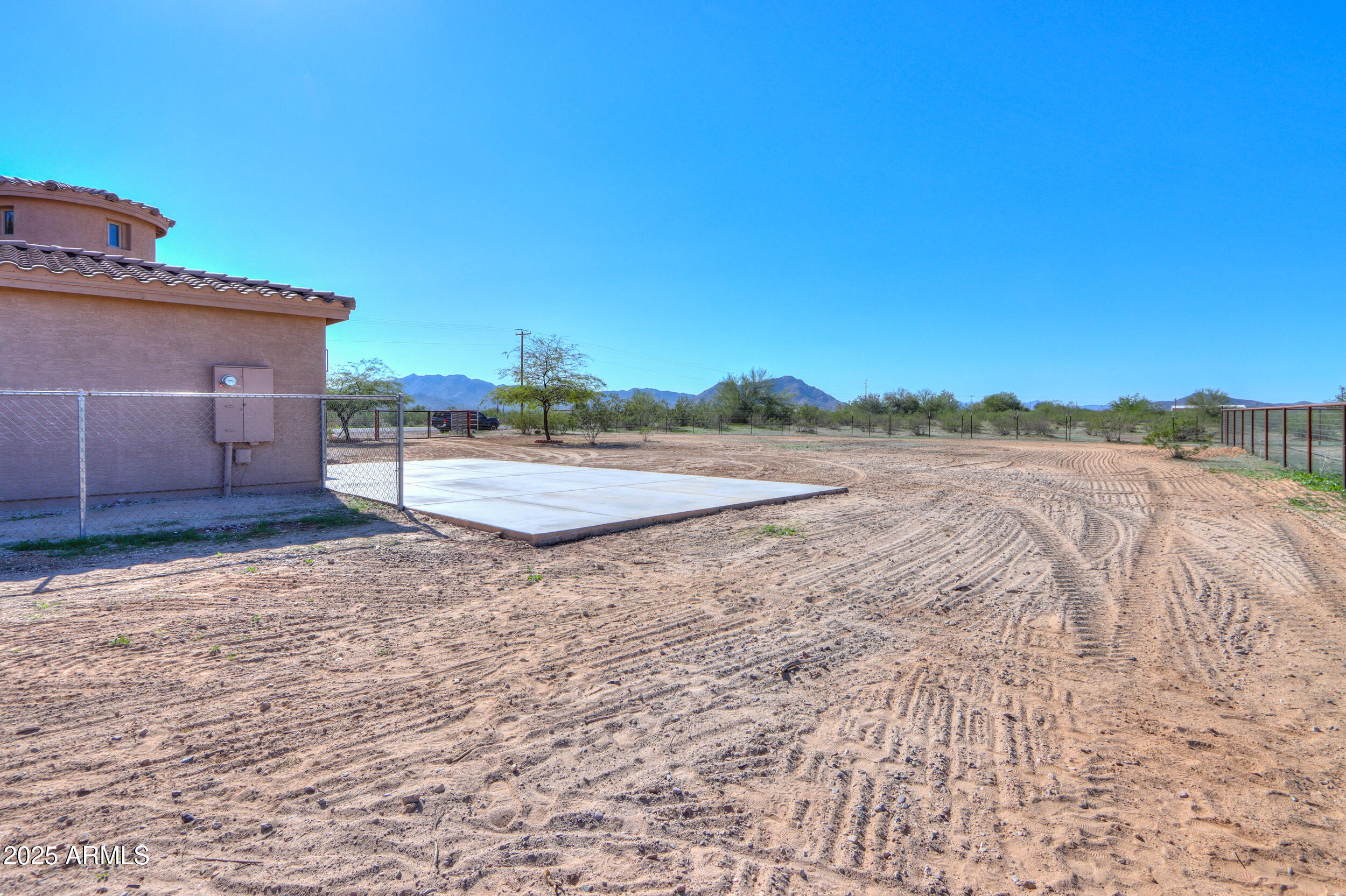 53304 West Barnes Road Maricopa, AZ 85139 - Photo 49 of 75 a view of a dry yard with wooden fence