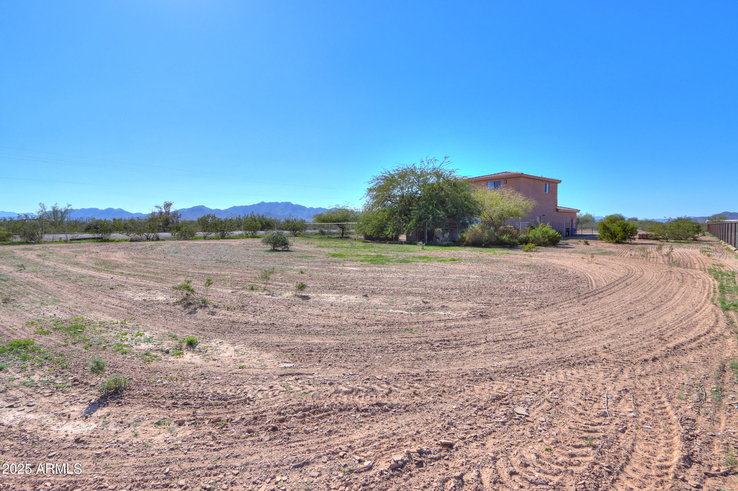 53304 West Barnes Road Maricopa, AZ 85139 - Photo 50 of 75 a view of a lake view with houses in the background