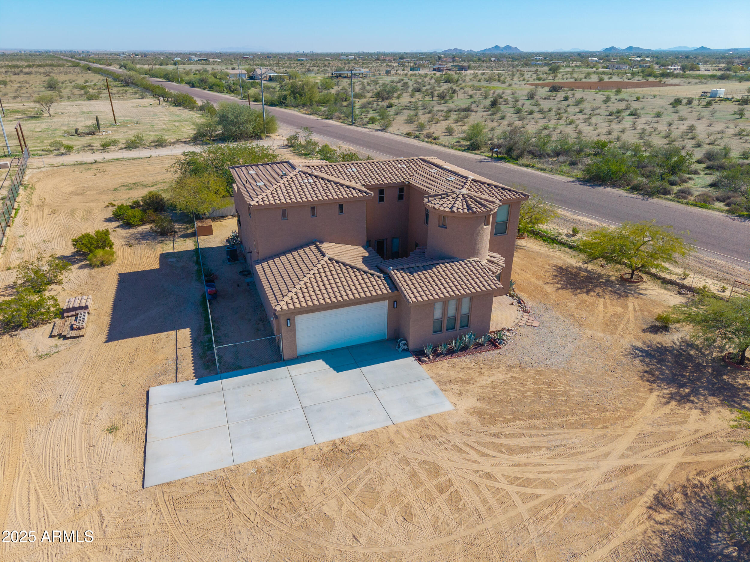 53304 West Barnes Road Maricopa, AZ 85139 - Photo 61 of 75 an aerial view of a house with a lake view