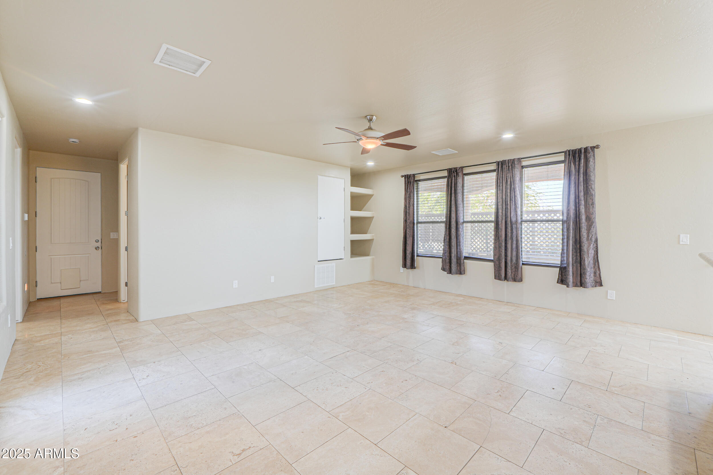 53304 West Barnes Road Maricopa, AZ 85139 - Photo 10 of 75 a view of an empty room with a window