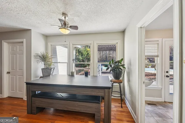 a view of kitchen island with furniture and wooden floor