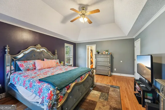 a bathroom with a tub a sink and a window