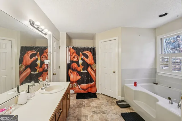 a view of a bathroom with wooden floor and a sink