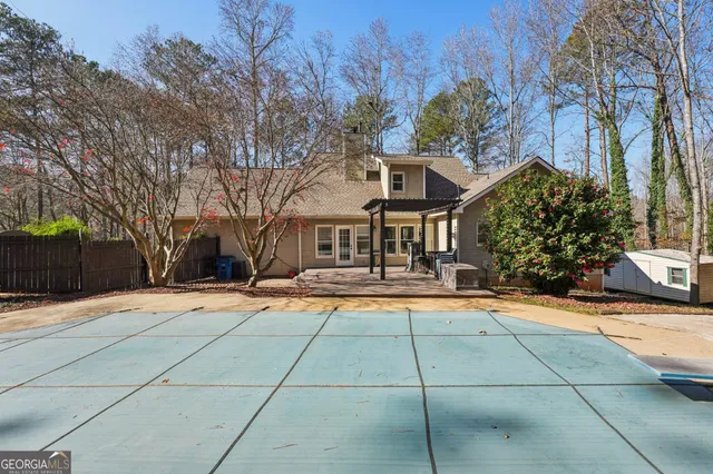 a view of a house with a yard from a balcony