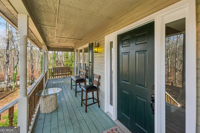 a view of a balcony with wooden floor
