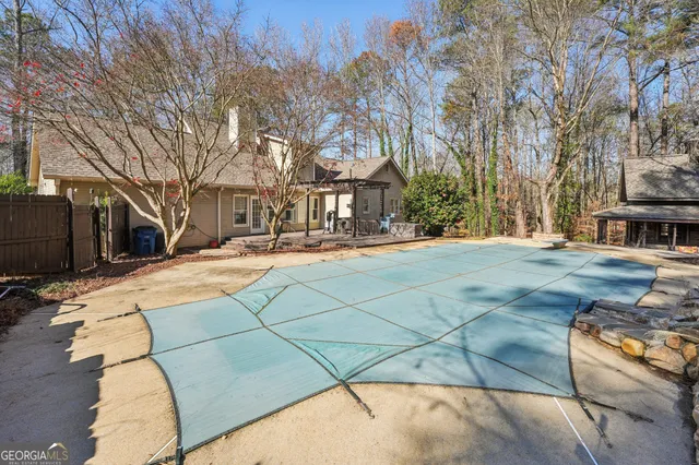 a view of a chairs and tables in a patio