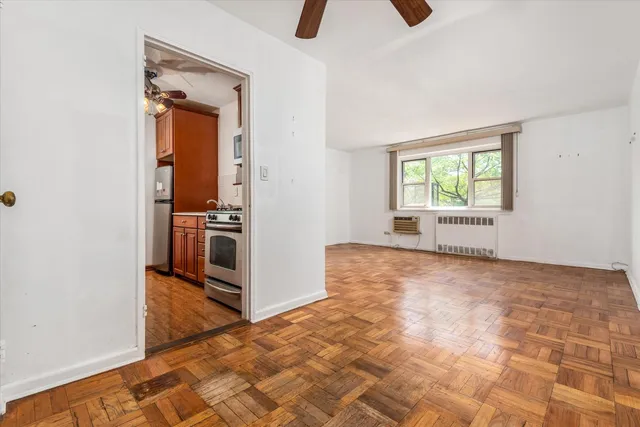 an empty room with windows and closet