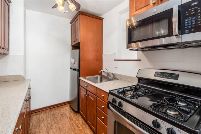 a kitchen with a stove and a microwave