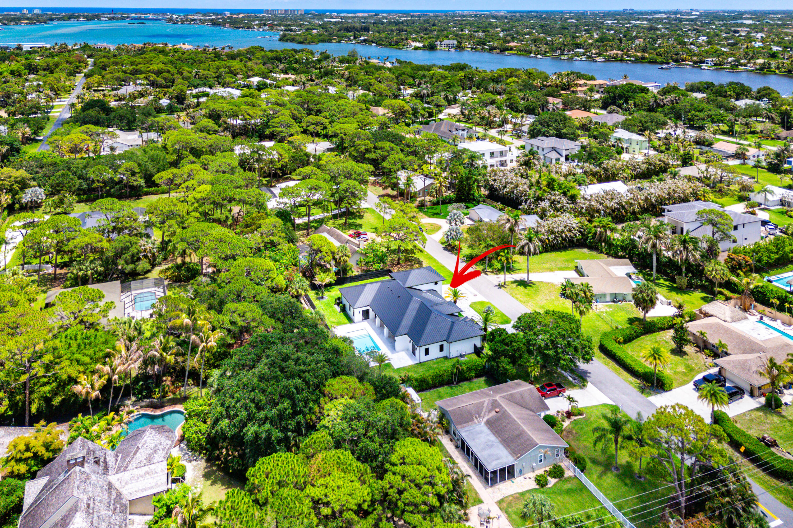 5701 Old Orange Road Jupiter, FL 33458 - Photo 45 of 46 an aerial view of residential house with outdoor space and trees all around
