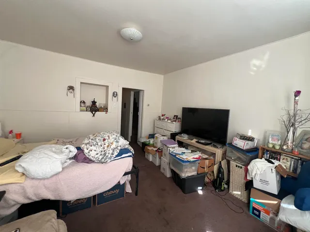 a workspace with furniture and a wooden floor