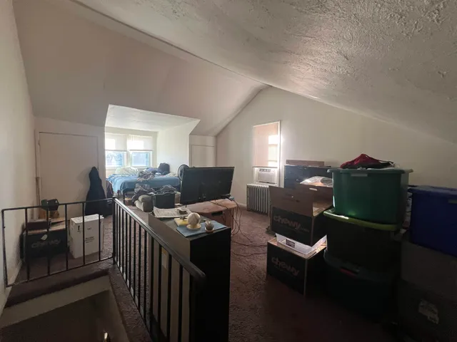 a workspace with furniture and a wooden floor