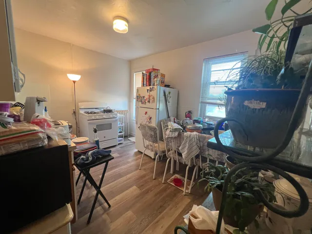 a kitchen with stainless steel appliances granite countertop a sink and cabinets