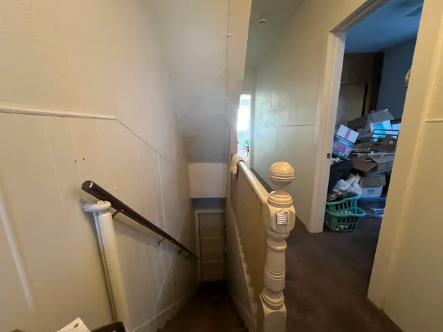 a view of a building and a cars park