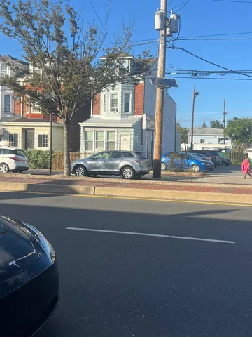 a car parked in front of a house