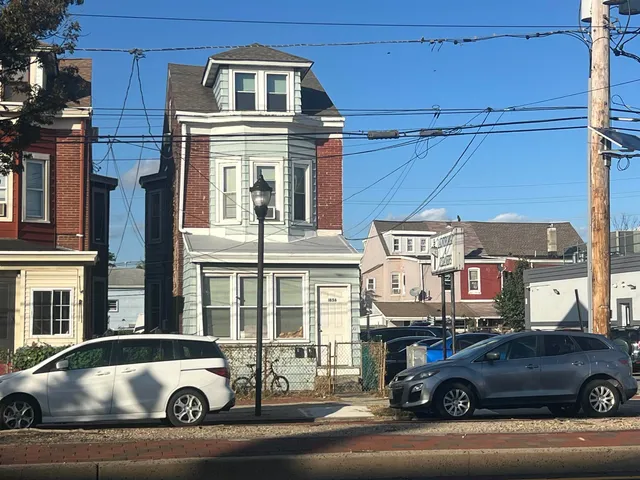 a front view of a house with street view