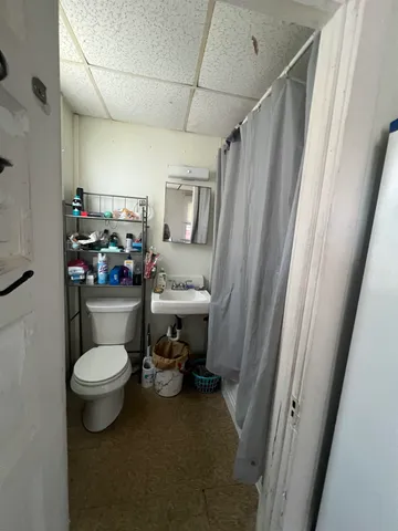 a bathroom with a toilet and a sink