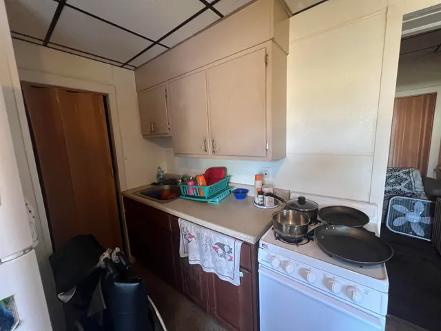 a utility room with sink dryer and washer