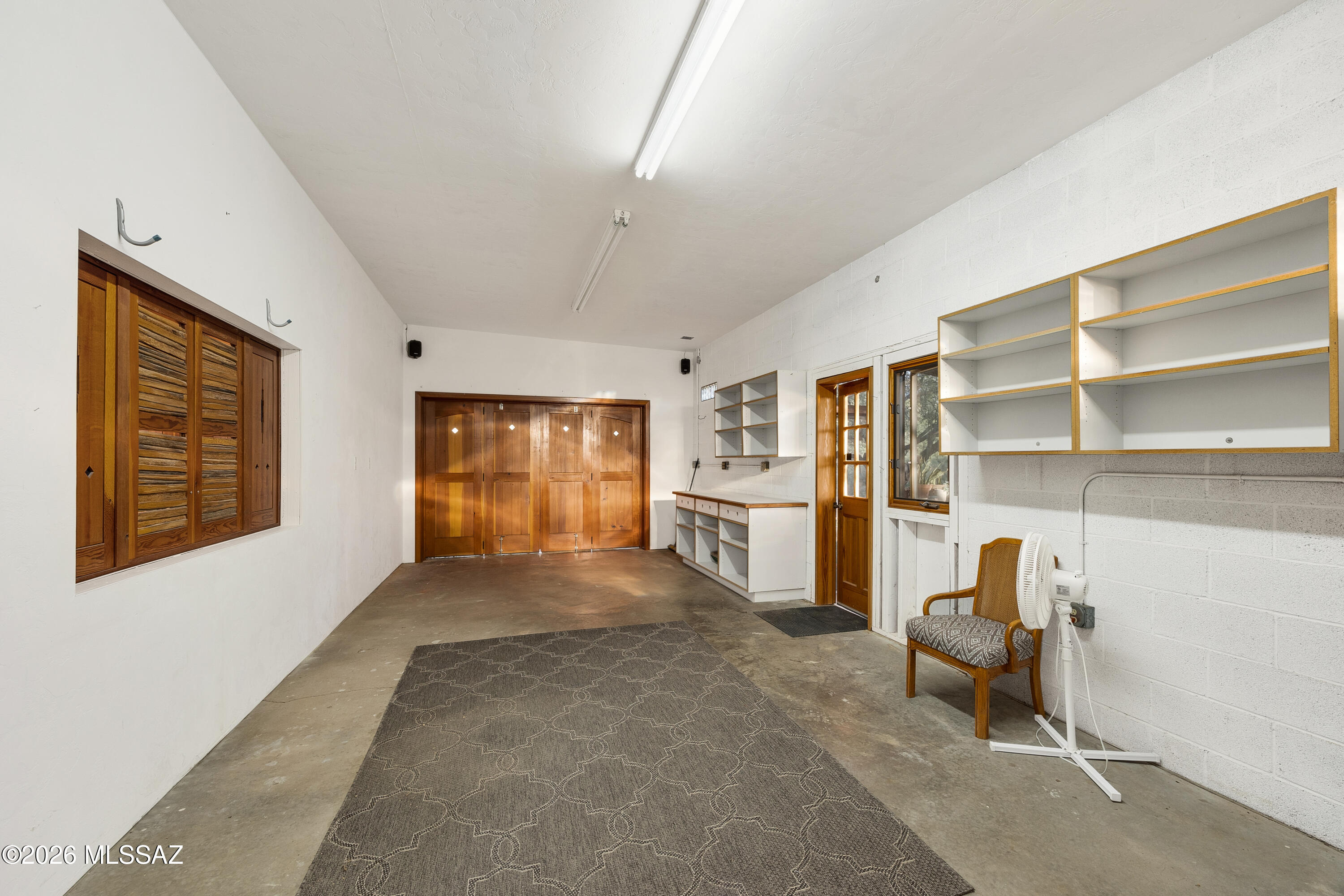 13013 East Redington Road Tucson, AZ 85749 - Photo 41 of 51 Oversized garage with workshop area.