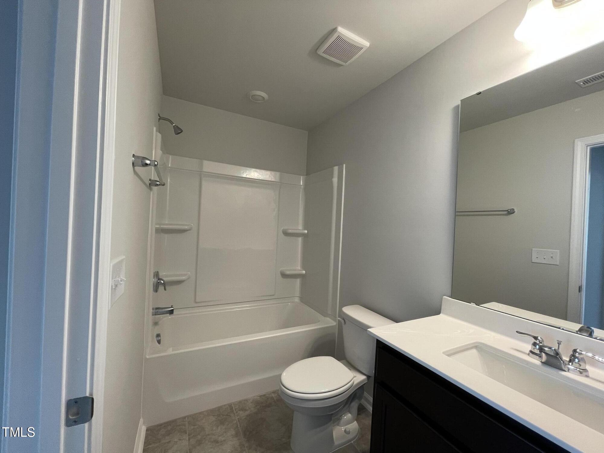 244 Paramount Drive Smithfield, NC 27577 - Photo 11 of 43 a bathroom with a sink a toilet and shower