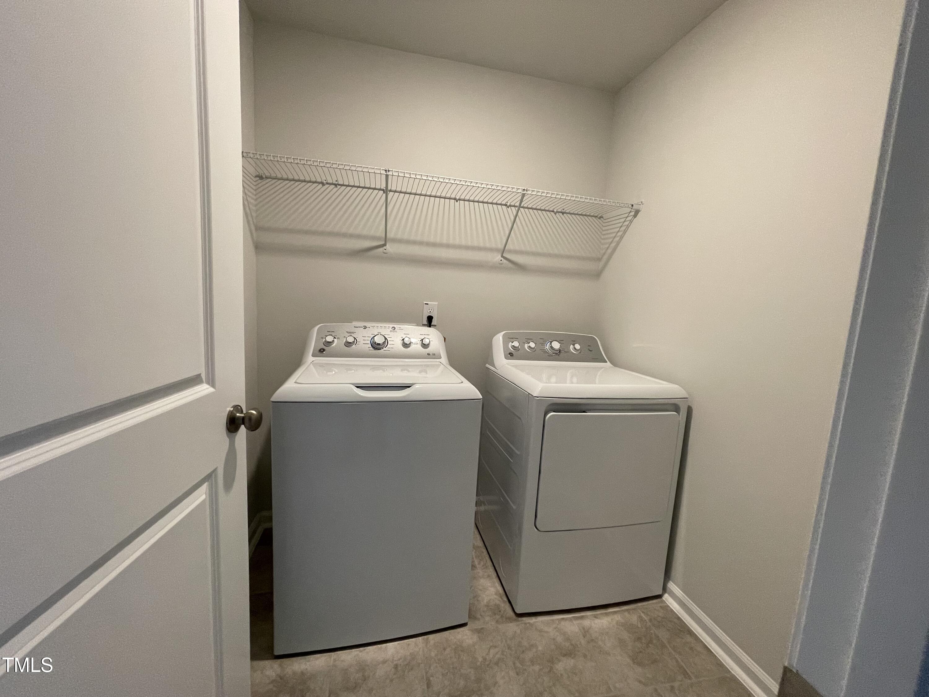 244 Paramount Drive Smithfield, NC 27577 - Photo 12 of 43 a utility room with dryer and washer