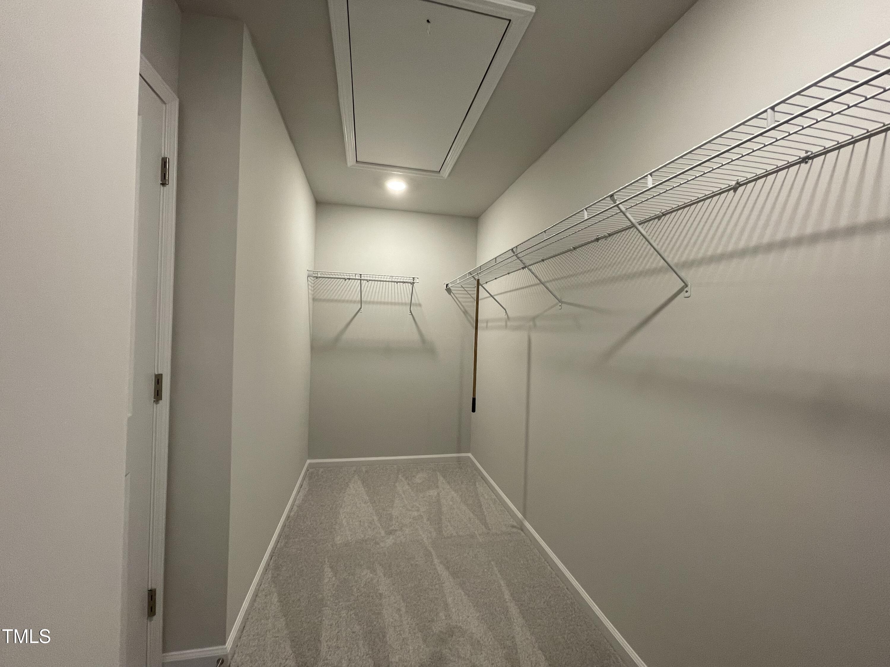 244 Paramount Drive Smithfield, NC 27577 - Photo 14 of 43 a view of a room with racks on the wall