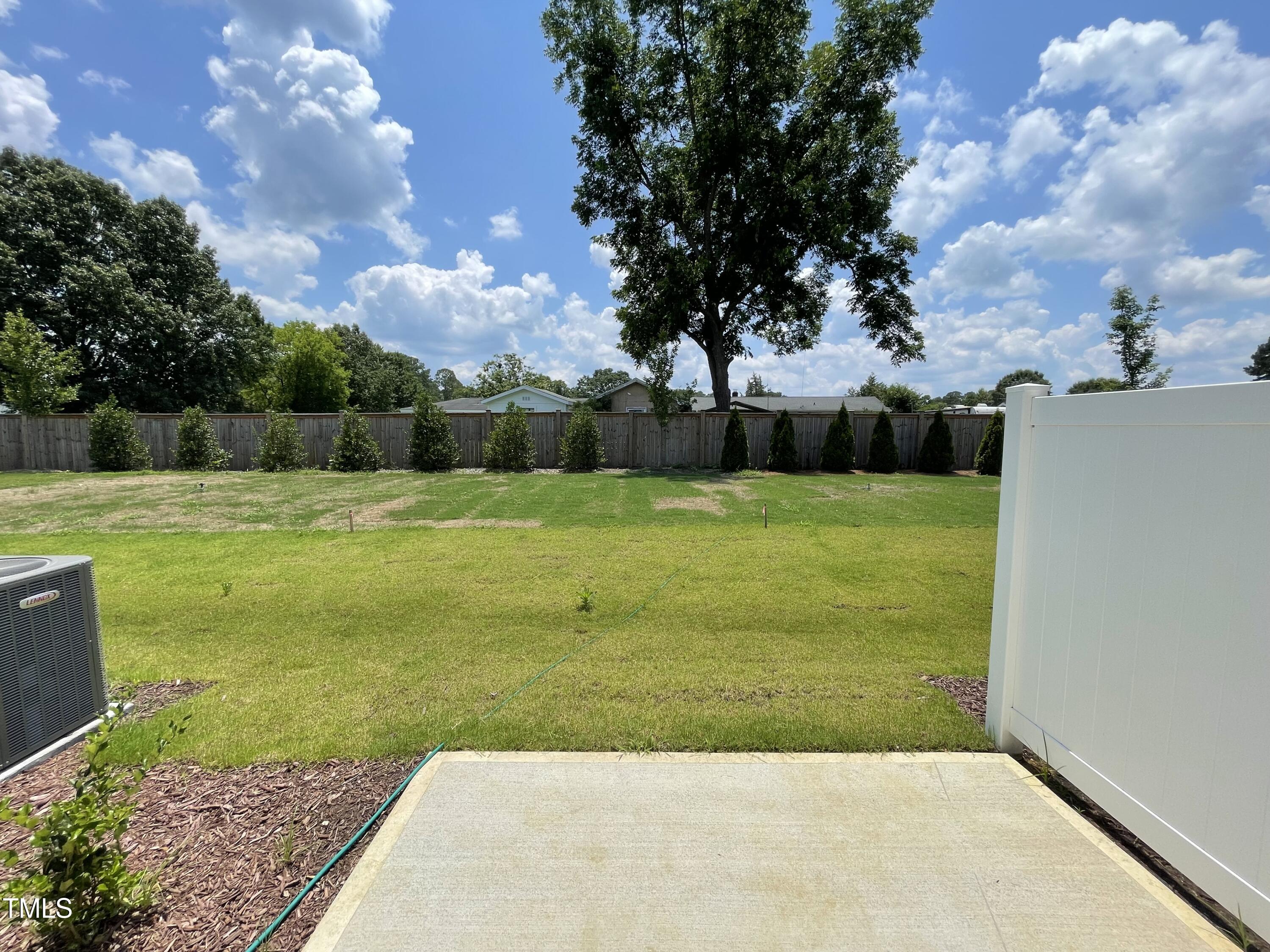 244 Paramount Drive Smithfield, NC 27577 - Photo 15 of 43 a view of a field with an trees