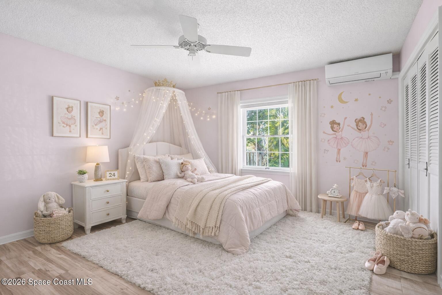 835 Sunswept Road Northeast Palm Bay, FL 32905 - Photo 17 of 36 a bedroom with a bed and a chandelier