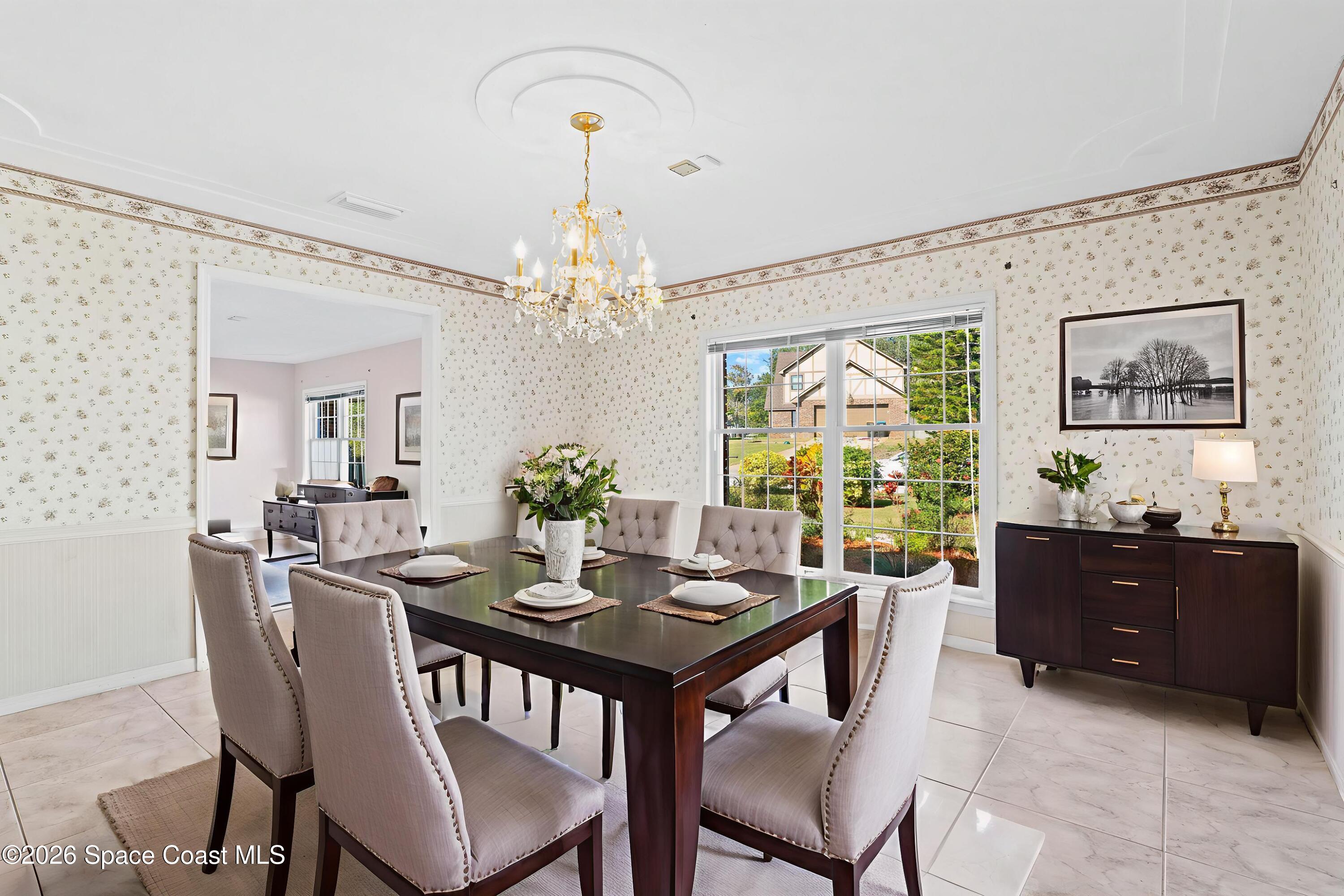 835 Sunswept Road Northeast Palm Bay, FL 32905 - Photo 20 of 36 a view of a dining room with furniture and window