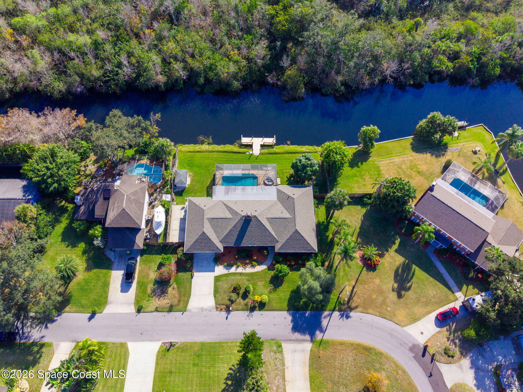 835 Sunswept Road Northeast Palm Bay, FL 32905 - Photo 25 of 36 an aerial view of house with yard swimming pool and outdoor seating