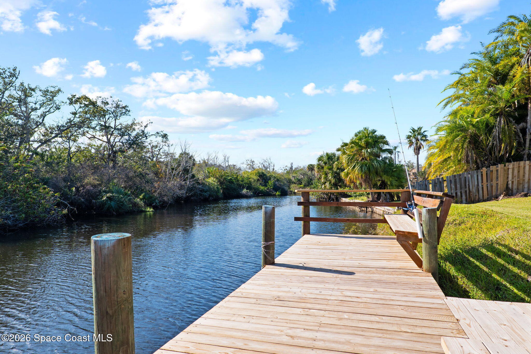 835 Sunswept Road Northeast Palm Bay, FL 32905 - Photo 28 of 36 a view of a lake with houses