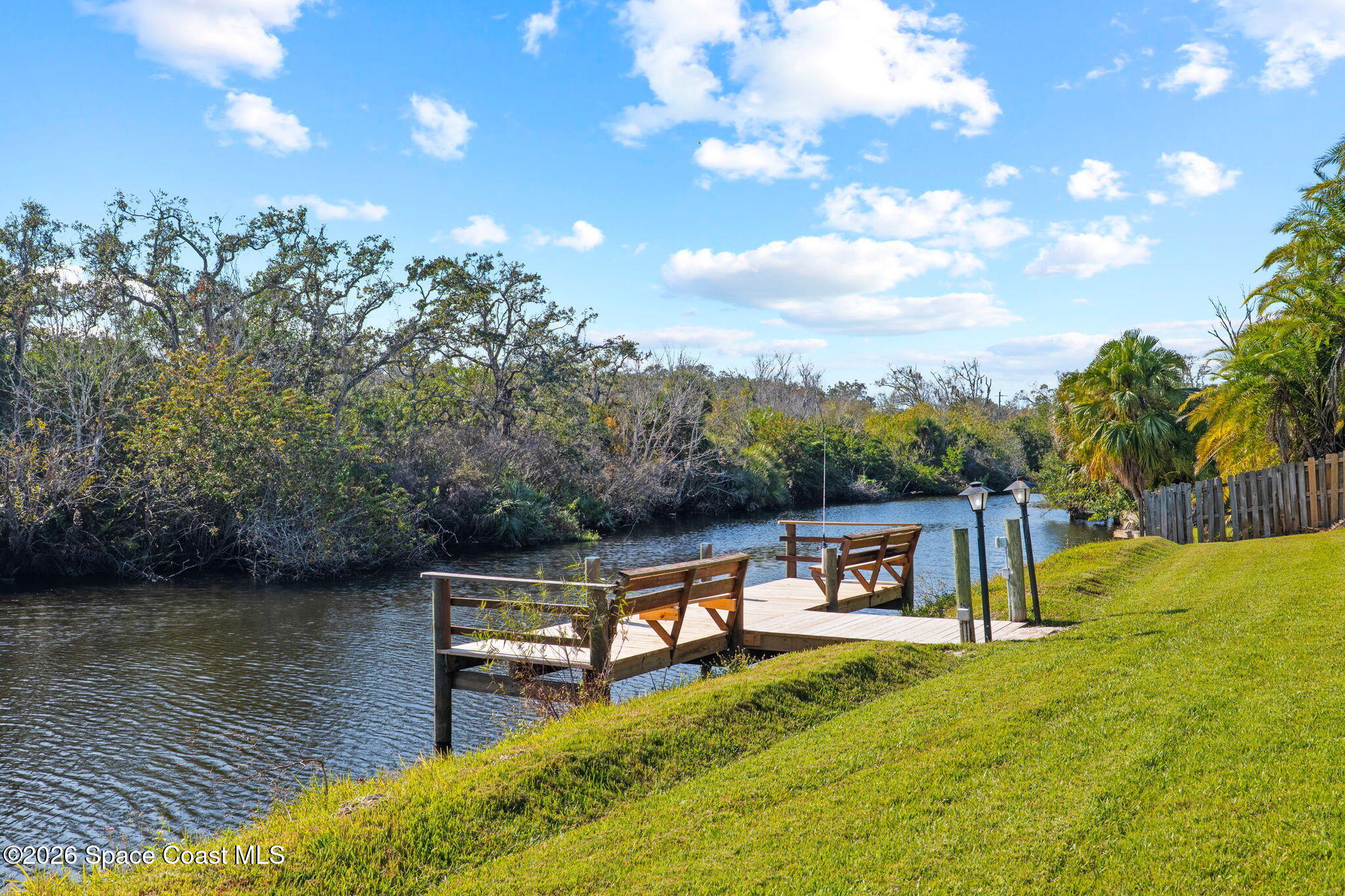 835 Sunswept Road Northeast Palm Bay, FL 32905 - Photo 29 of 36 a view of house with outdoor space and sitting area