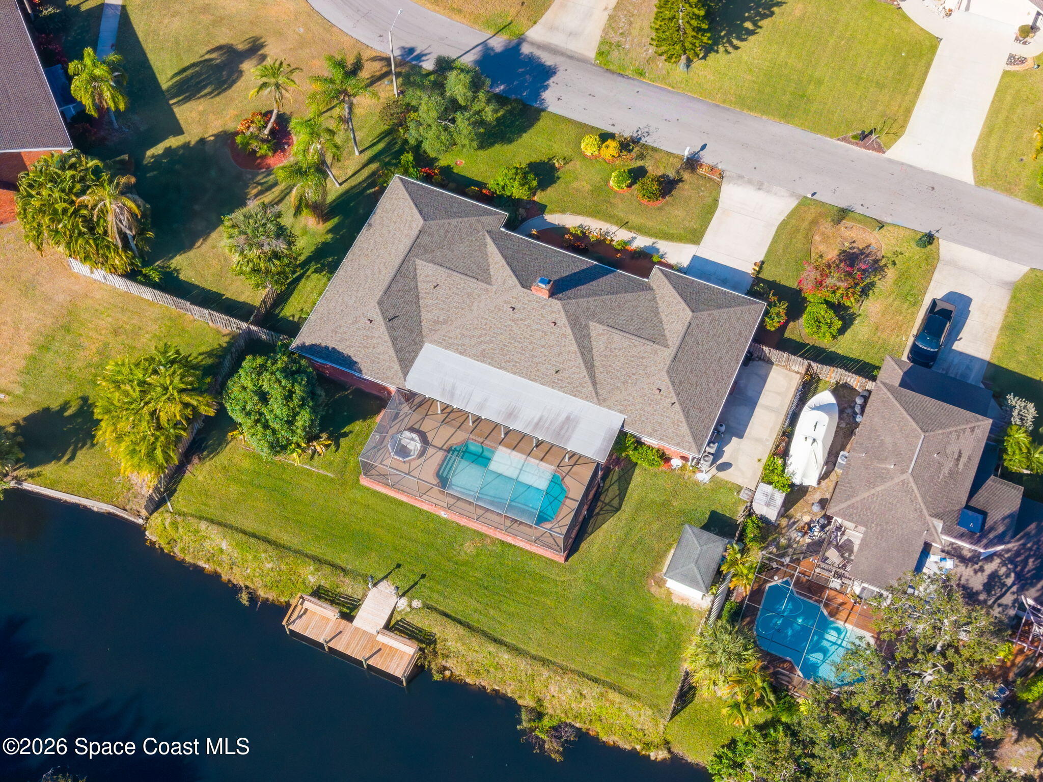 835 Sunswept Road Northeast Palm Bay, FL 32905 - Photo 33 of 36 an aerial view of a house with a swimming pool