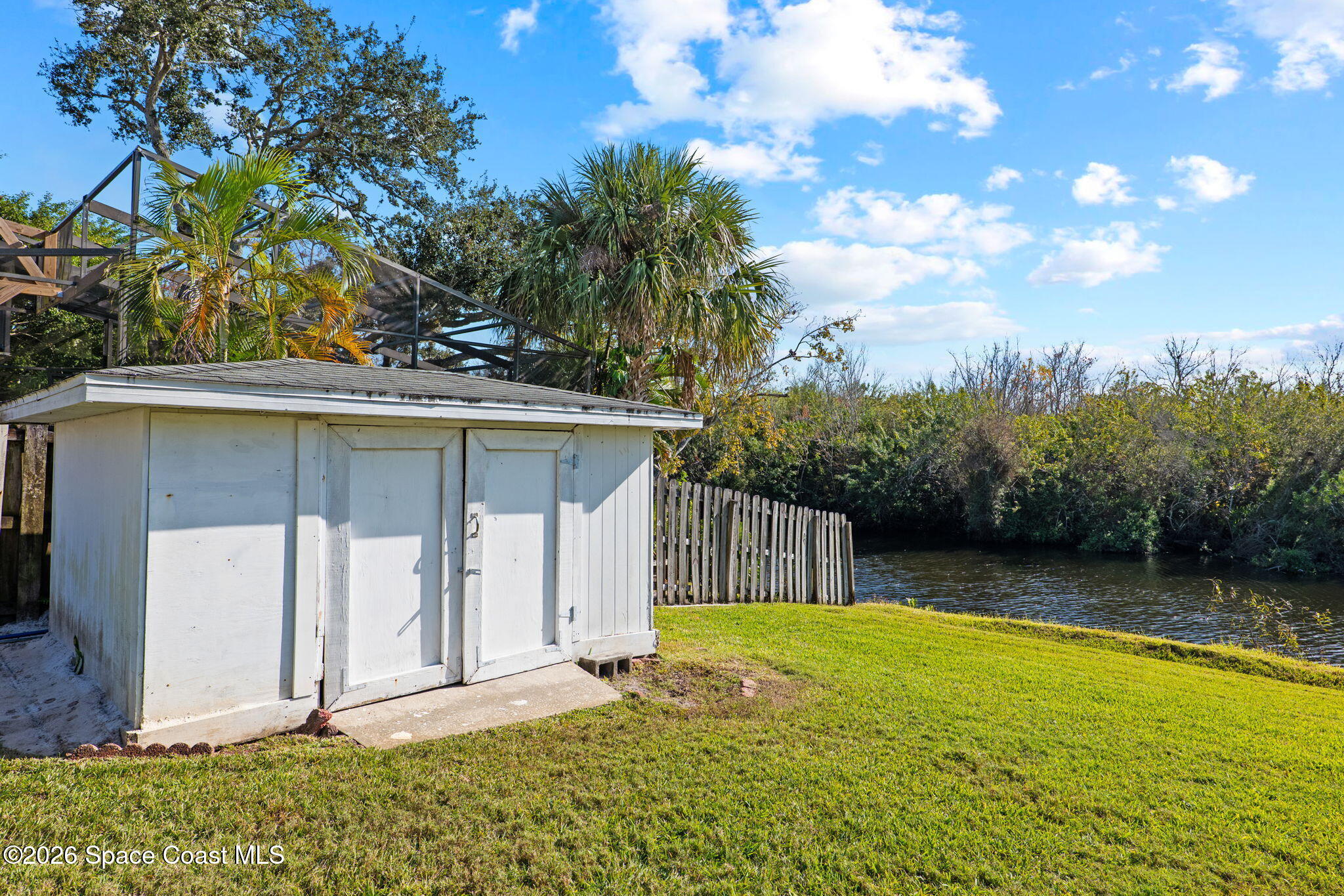 835 Sunswept Road Northeast Palm Bay, FL 32905 - Photo 36 of 36 a view of a house with backyard and sitting area