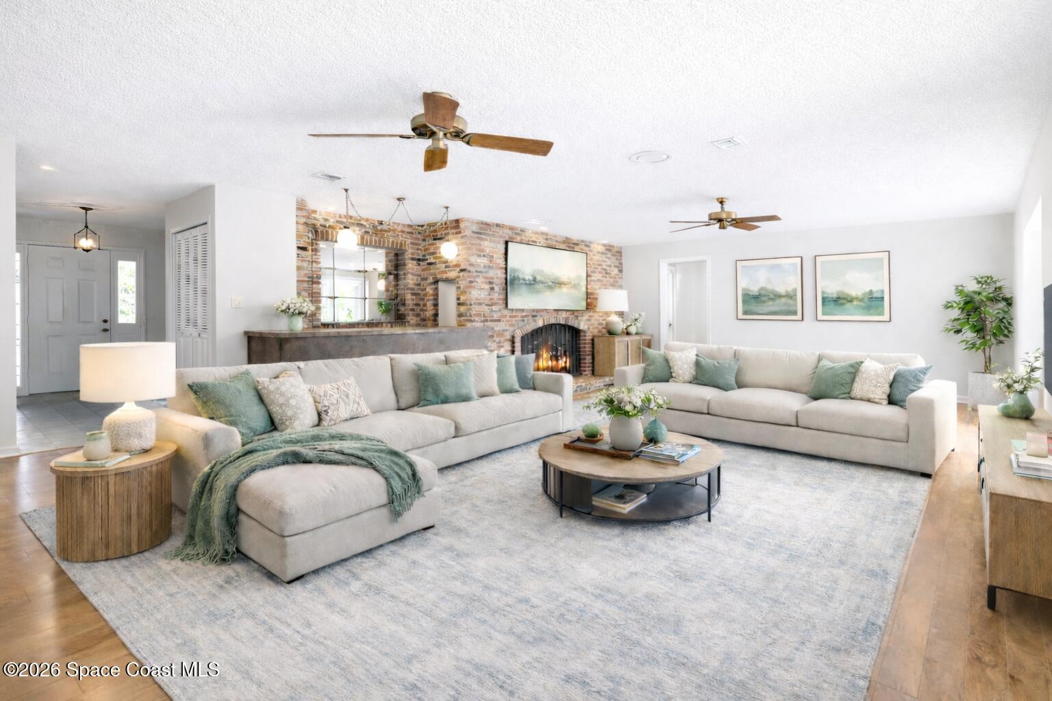 835 Sunswept Road Northeast Palm Bay, FL 32905 - Photo 4 of 36 a living room with furniture and a large window