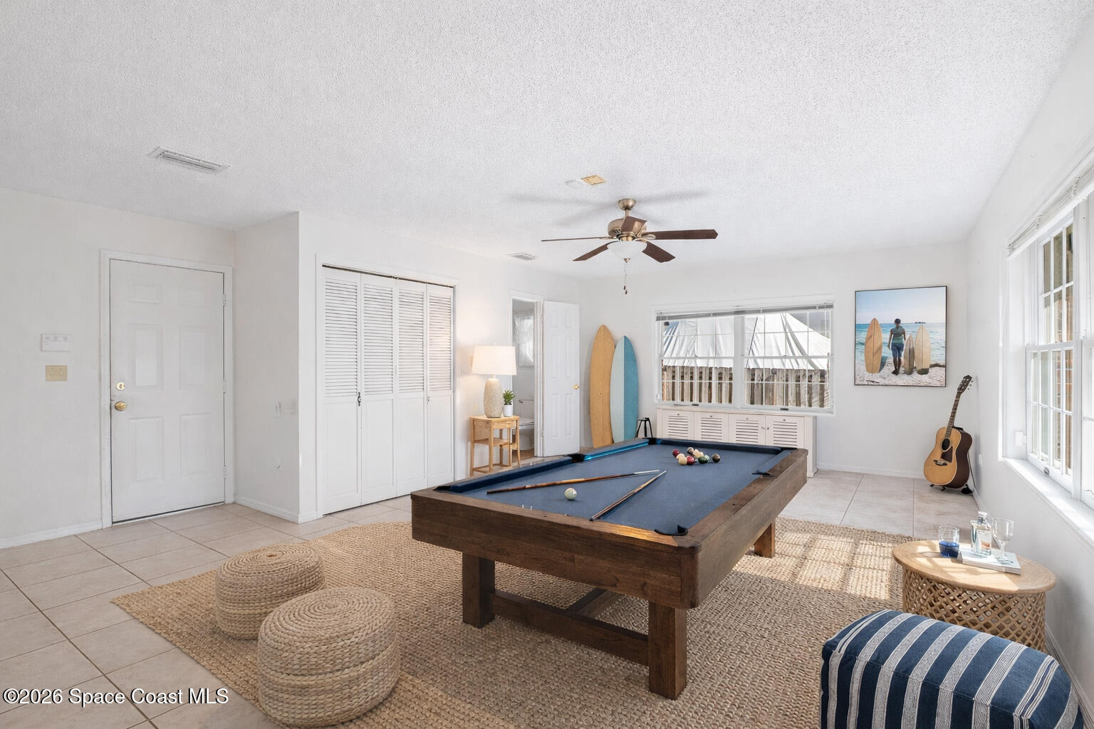 835 Sunswept Road Northeast Palm Bay, FL 32905 - Photo 7 of 36 a living room with furniture a table and wooden floor