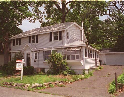 3 Channel Avenue Norwalk, CT 06854 - Photo 1 of 1 a front view of a house with a garden and plants