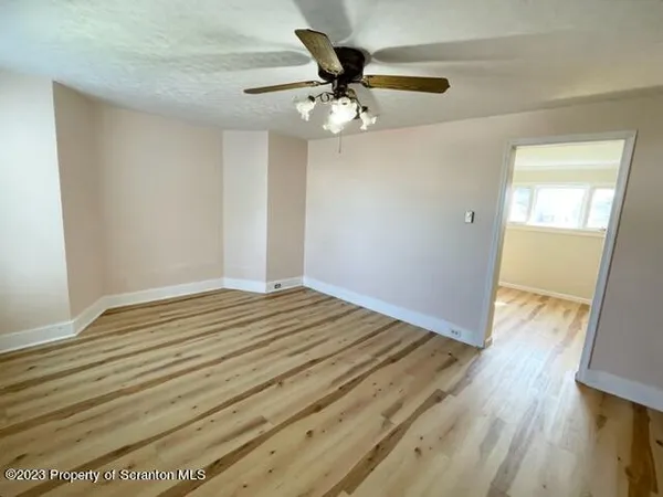a view of a livingroom with wooden floor
