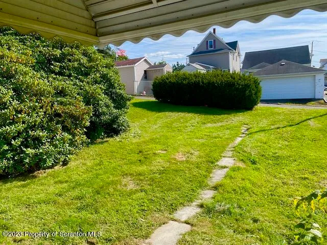 a view of a back yard of the house