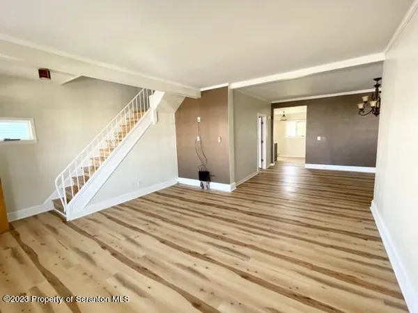 a view of a hallway view with staircase