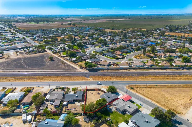 an aerial view of a house with outdoor space