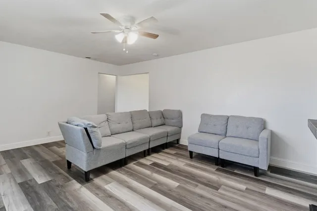 a living room with furniture a bed and a couch