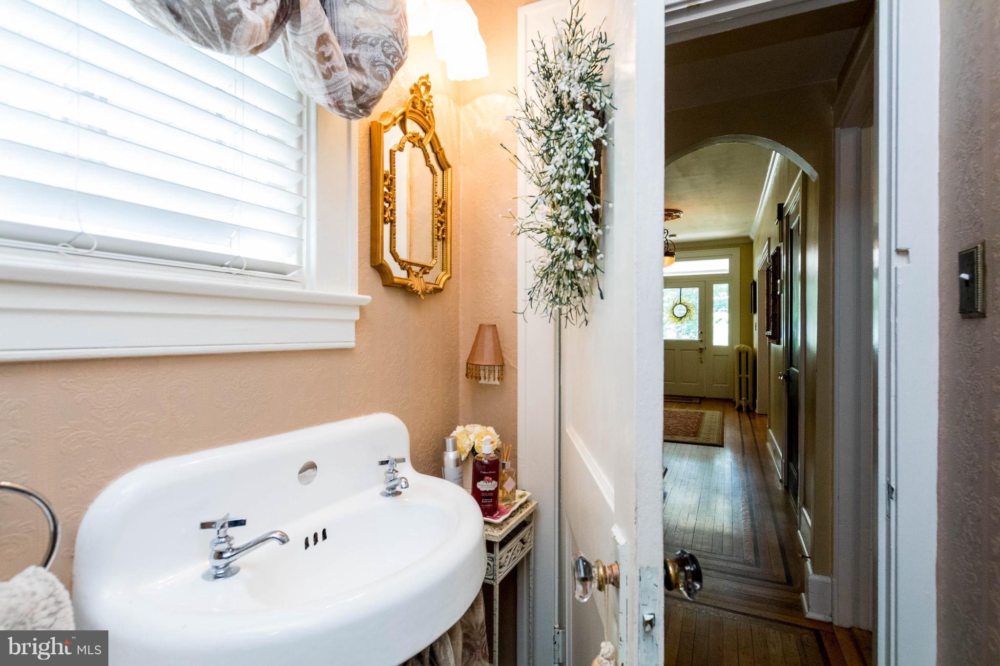 423 South Rolling Road Baltimore, MD 21228 - Photo 16 of 30 a bathroom with a bathtub and a sink