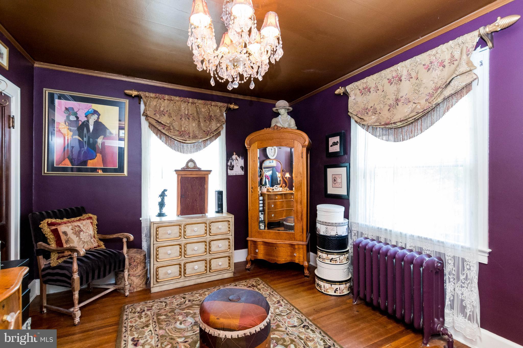 423 South Rolling Road Baltimore, MD 21228 - Photo 22 of 30 a living room with furniture and a chandelier